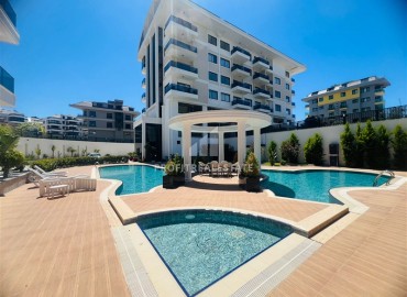 Апартаменты 1+1, 54м², с дизайнерским интерьером в премиум-комплексе в 100м от моря в районе Каргыджак, Алания ID-19266 фото-1