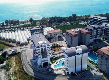 Апартаменты 1+1, 54м², с дизайнерским интерьером в премиум-комплексе в 100м от моря в районе Каргыджак, Алания ID-19266 фото-11