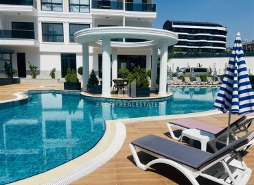 Апартаменты 1+1, 54м², с дизайнерским интерьером в премиум-комплексе в 100м от моря в районе Каргыджак, Алания ID-19266 фото-13