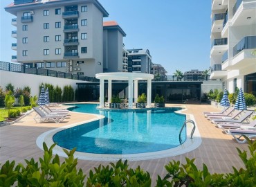 Апартаменты 1+1, 54м², с дизайнерским интерьером в премиум-комплексе в 100м от моря в районе Каргыджак, Алания ID-19266 фото-18