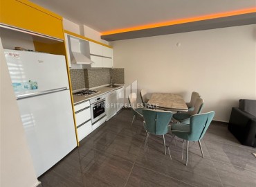 Готовая к проживанию, квартира с одной спальней, 55м², в комплексе премиум класса в 300м от моря в Махмутларе, Алания ID-19382 фото-2