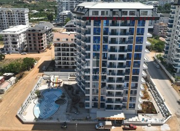 Двухкомнатные апартаменты, 51,3м², в элитном комплексе на этапе строительства, в Махмутларе, Алания ID-17654 фото-1