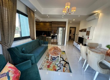 Уютная двухкомнатная квартира, 53м², в элитном комплексе с отличной локацией в 500м от моря в Махмутларе, Алания ID-19384 фото-3