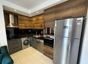 Уютная двухкомнатная квартира, 53м², в элитном комплексе с отличной локацией в 500м от моря в Махмутларе, Алания ID-19384 фото-8