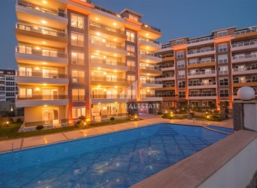 Уютная двухкомнатная квартира, 65м², в комплексе премиум класса в 100м от моря в районе Кестель, Алания ID-19394 фото-1