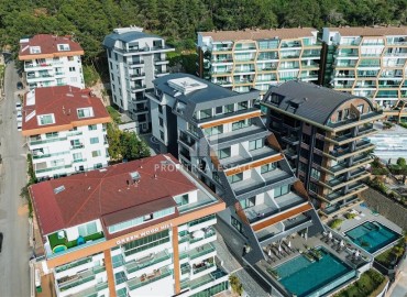 Фешенебельный дуплекс 3+1, 145м², с личным садом 90м² в элитном комплексе в Каргыджаке, Алания ID-19399 фото-1