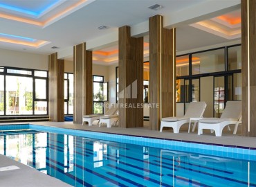 Комфортабельная двухкомнатная квартира, 60м², в новом элитном комплексе в 450м от моря, в Махмутларе, Алания ID-19409 фото-16
