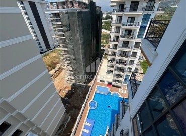 Двухкомнатная квартира, 57м², с чистовой отделкой в современном комплексе премиум класса в Махмутларе, Алания ID-19418 фото-9