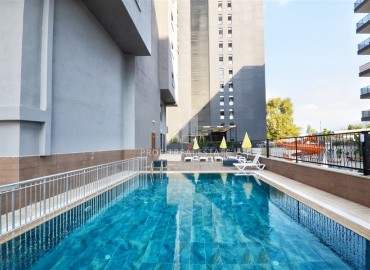 Апартаменты с одной спальней, 50м², с чистовой отделкой в комплексе премиум класса на центральной улице Махмутлара, Алания ID-19422 фото-12