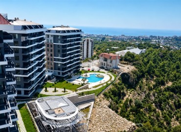 Видовая двухкомнатная квартира, 71м², на высоком этаже в новом элитном комплексе у подножия гор в районе Кестель, Алания ID-19423 фото-1