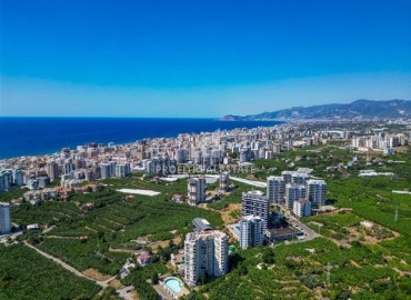 Меблированная квартира 2+1, 110м², у подножия гор, в комплексе с зимним бассейном в Махмутларе, Алания ID-19426 фото-25