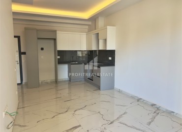 Апартаменты с одной спальней, 55м², в комфортабельном комплексе с инфраструктурой в Махмутларе, Алания ID-19429 фото-2