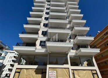 Трехкомнатная квартира с чистовой отделкой, 80м², в новой резиденции на центральной улице Махмутлара, Алания ID-19430 фото-1