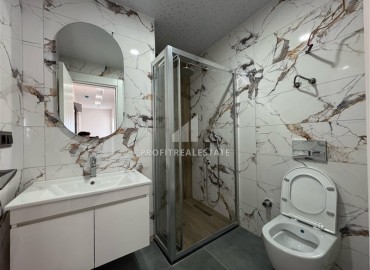 Трехкомнатная квартира с чистовой отделкой, 80м², в новой резиденции на центральной улице Махмутлара, Алания ID-19430 фото-7