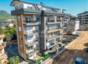 Квартира с одной спальней, 50м², с чистовой отделкой в новой резиденции с инфраструктурой в районе Оба, Алания ID-19449 фото-1