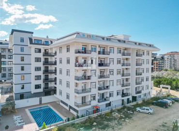 Элегантная двухкомнатная квартира, 50м², в новом комплексе с хорошей инфраструктурой в Махмутларе, Алания, по привлекательной цене ID-19641 фото-1