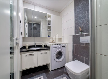Стильная квартира с одной спальней, 65м², с видом на море в элитном комплексе в районе Алании - Тосмур ID-19469 фото-18