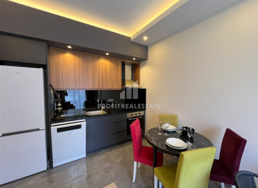 Меблированная двухкомнатная квартира, 50м², в уютном комплексе у подножия гор в районе Оба, Алания. ID-19476 фото-4
