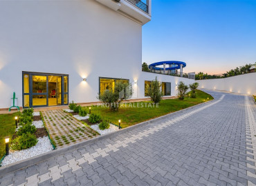 Видовые двухкомнатные апартаменты, 54м², в новостройке премиум класса в районе Махмутлар, Алания ID-19483 фото-11