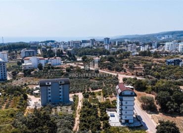 Частично меблированные двухкомнатные апартаменты, 55м², в новом комплексе премиум класса в Авсалларе, Алания ID-19498 фото-27