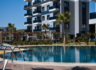 Частично меблированные двухкомнатные апартаменты, 55м², в новом комплексе премиум класса в Авсалларе, Алания ID-19498 фото-23
