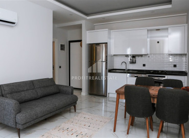 Частично меблированные двухкомнатные апартаменты, 55м², в новом комплексе премиум класса в Авсалларе, Алания ID-19498 фото-2