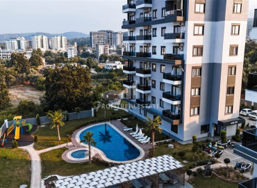 Частично меблированные двухкомнатные апартаменты, 55м², в новом комплексе премиум класса в Авсалларе, Алания ID-19498 фото-1