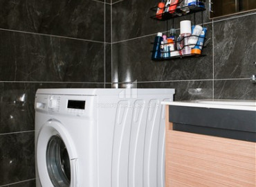 Частично меблированные двухкомнатные апартаменты, 55м², в новом комплексе премиум класса в Авсалларе, Алания ID-19498 фото-12