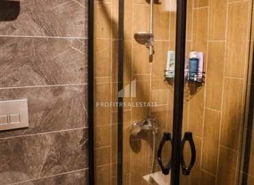 Частично меблированные двухкомнатные апартаменты, 55м², в новом комплексе премиум класса в Авсалларе, Алания ID-19498 фото-13