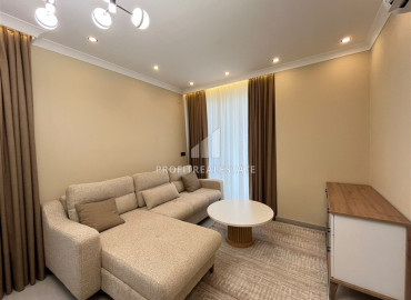 Элегантная двухкомнатная квартира, 42м², в элитной резиденции в 850м от моря в Махмутларе, Алания ID-19505 фото-2