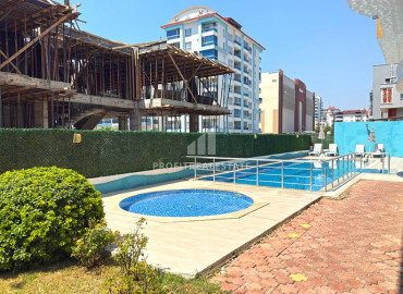 Готовая к проживанию, квартира 1+1, 57м², в комплексе с бассейном в районе субботнего рынка в Махмутларе, Алания ID-19508 фото-21