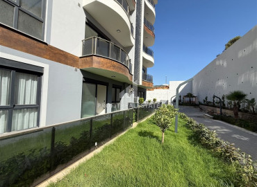 Квартира с одной спальней, 50м², с личным садом в новой элитной резиденции в Махмутларе, Алания ID-19520 фото-11