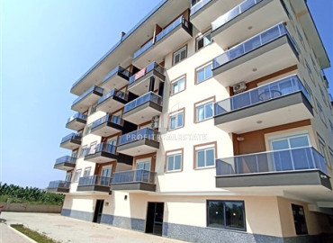 Квартира с одной спальней, 50м², в новом комплексе с бассейном в 500м от моря в Каргыджаке, Алания ID-19551 фото-1