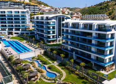 Двухкомнатные апартаменты с бытовой техникой, 60м², в элитном комплексе в 750м от моря, Алания, Каргыджак ID-19553 фото-1