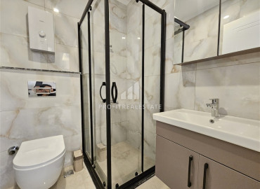 Дизайнерская квартира с одной спальней, 55м², в новостройке премиум класса в центре Махмутлара, Алания ID-19563 фото-8