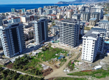 Дизайнерская квартира с одной спальней, 55м², в новостройке премиум класса в центре Махмутлара, Алания ID-19563 фото-16