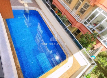 Меблированная двухкомнатная квартира, 50м², в современном комплексе у моря в центре Алании ID-19599 фото-9