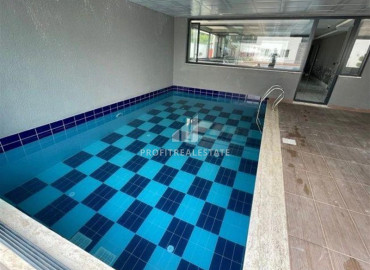 Двухкомнатная меблированная квартира, 61м², в комфортабельном комплексе у моря в Каргыджаке, Алания ID-19601 фото-14