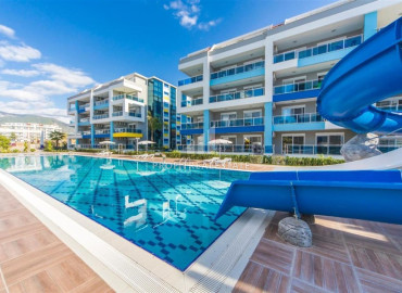Уютная двухкомнатная квартира, 65м², в элитном комплексе в 200м от моря в районе Кестель, Алания ID-19605 фото-1
