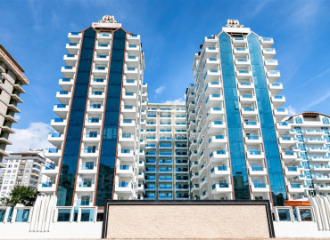 Элитная двухкомнатная квартира, 70м², в комплексе с отельной инфраструктурой, в 400 метрах от моря в Махмутларе, Алания ID-19625 фото-1