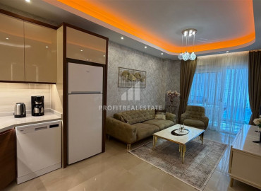 Элитная двухкомнатная квартира, 70м², в комплексе с отельной инфраструктурой, в 400 метрах от моря в Махмутларе, Алания ID-19625 фото-3