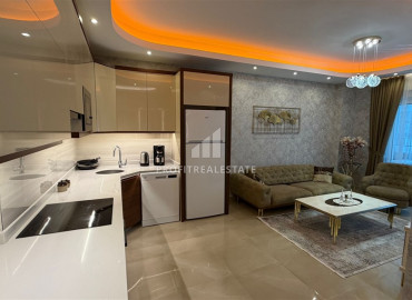 Элитная двухкомнатная квартира, 70м², в комплексе с отельной инфраструктурой, в 400 метрах от моря в Махмутларе, Алания ID-19625 фото-5