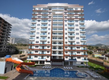 A beautiful complex from a reliable construction company in the Mahmutlar district ID-0115 фото-1