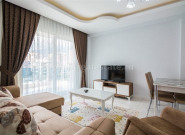 Меблированная двухкомнатная квартира в закрытом комплексе, 50м.кв. в Махмутларе ID-3241 фото-5