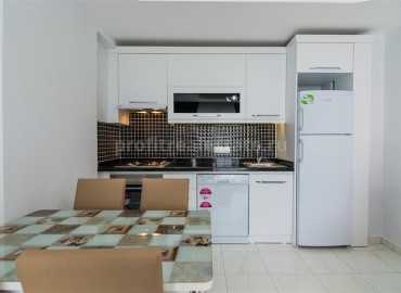 Меблированная двухкомнатная квартира в закрытом комплексе, 50м.кв. в Махмутларе ID-3241 фото-6