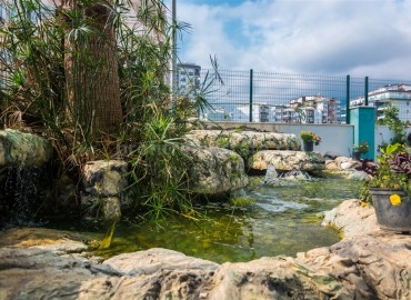 Меблированная двухкомнатная квартира в закрытом комплексе, 50м.кв. в Махмутларе ID-3241 фото-16