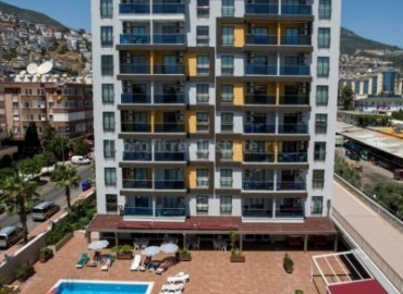 Комплекс с квартирами различных планировок недалеко от пляжа Клеопатры в центре Алании, Турция ID-0131 фото-2