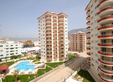 Apartment in the center of Mahmutlar in a complex with a swimming pool ID-0136 фото-1