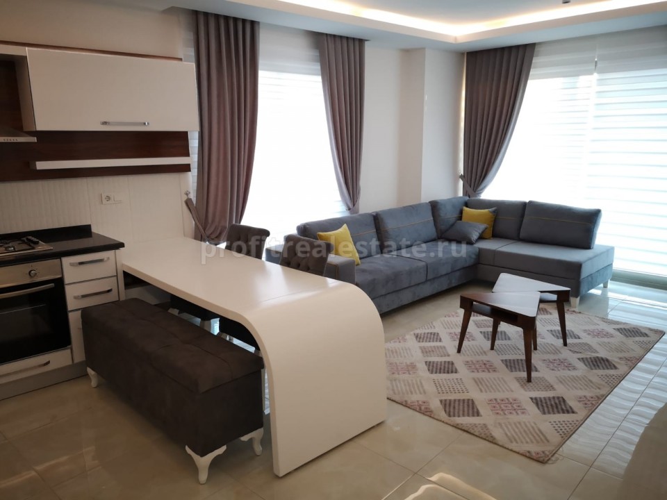 Аренда двухкомнатных апартаментов класса люкс в комплексе с инфраструктурой отеля в районе Махмутлар ID-3994 фото-1