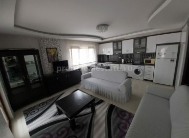Апартаменты 1+1, с мебелью и техникой, в центре Махмутлара в 300 метрах от моря ID-3802 фото-2}}